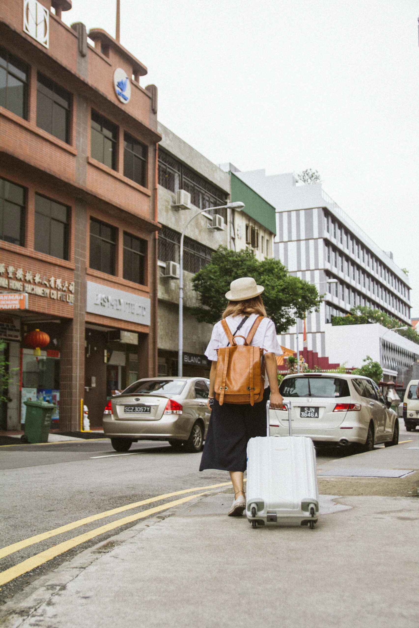 Woman leaving with her suitcase