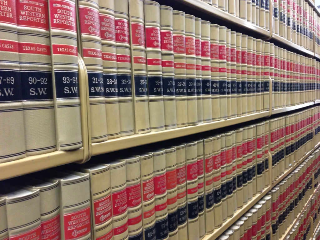A law library bookshelf featuring the Utah Code, highlighting the transition to Title 81 for family law cases in 2026.